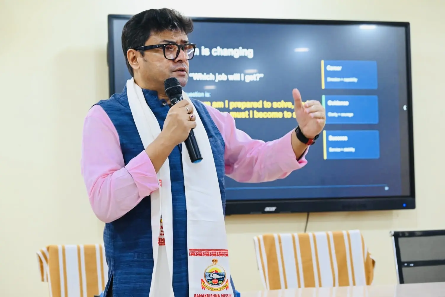 Close-up of Dr. Jayanta Ghosh presenting the clarity, capability and contribution career framework to students